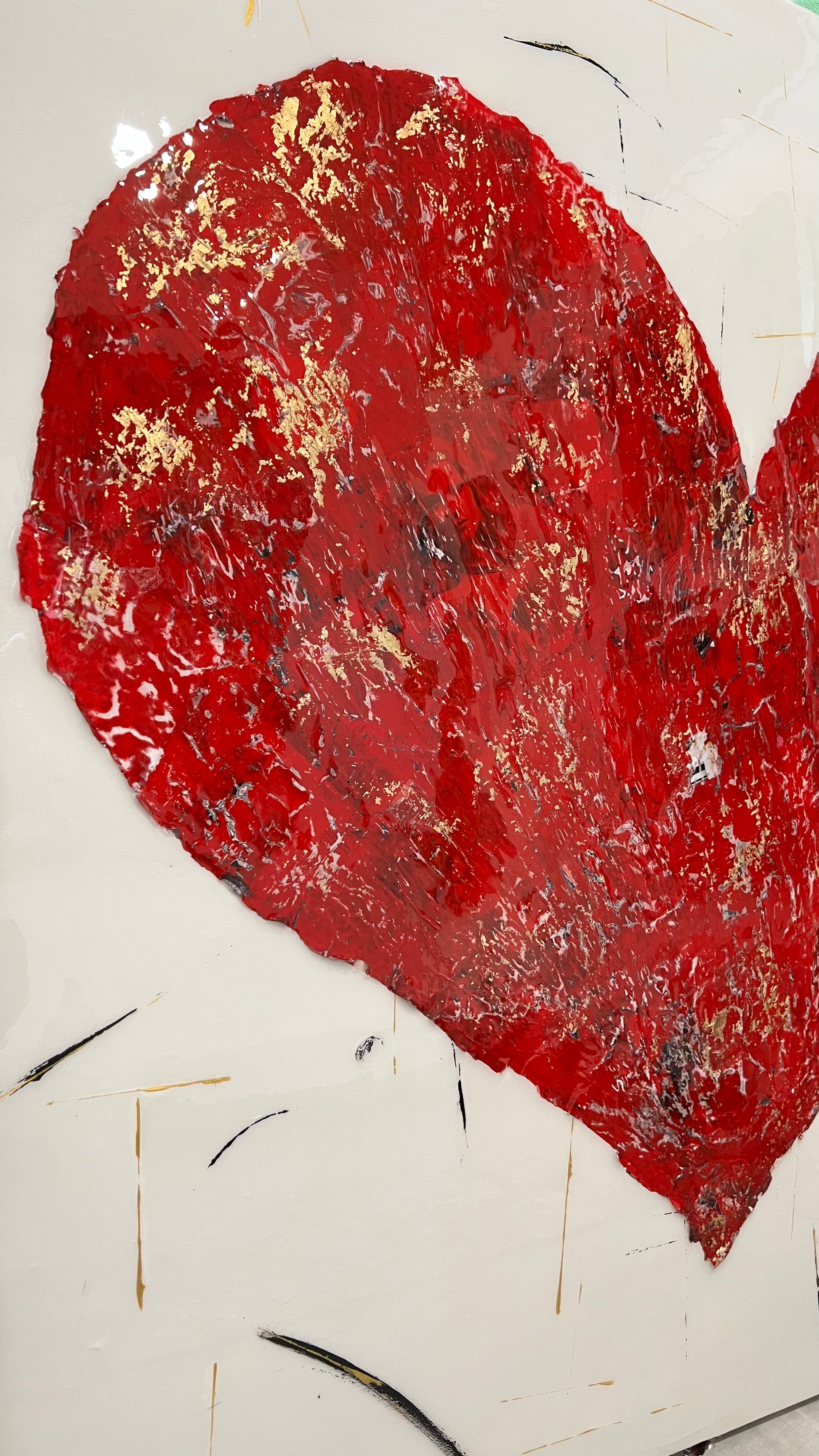 side view of a unique artwork of a mixed media collage red Heart